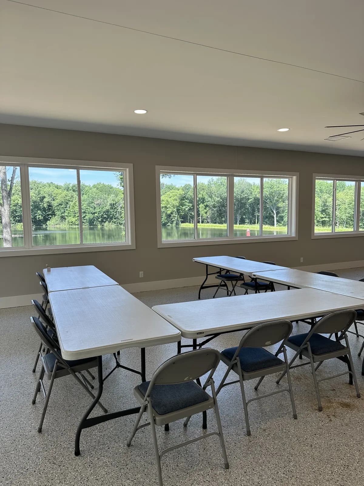 The activity center interior, a wall of windows overlooking the lake