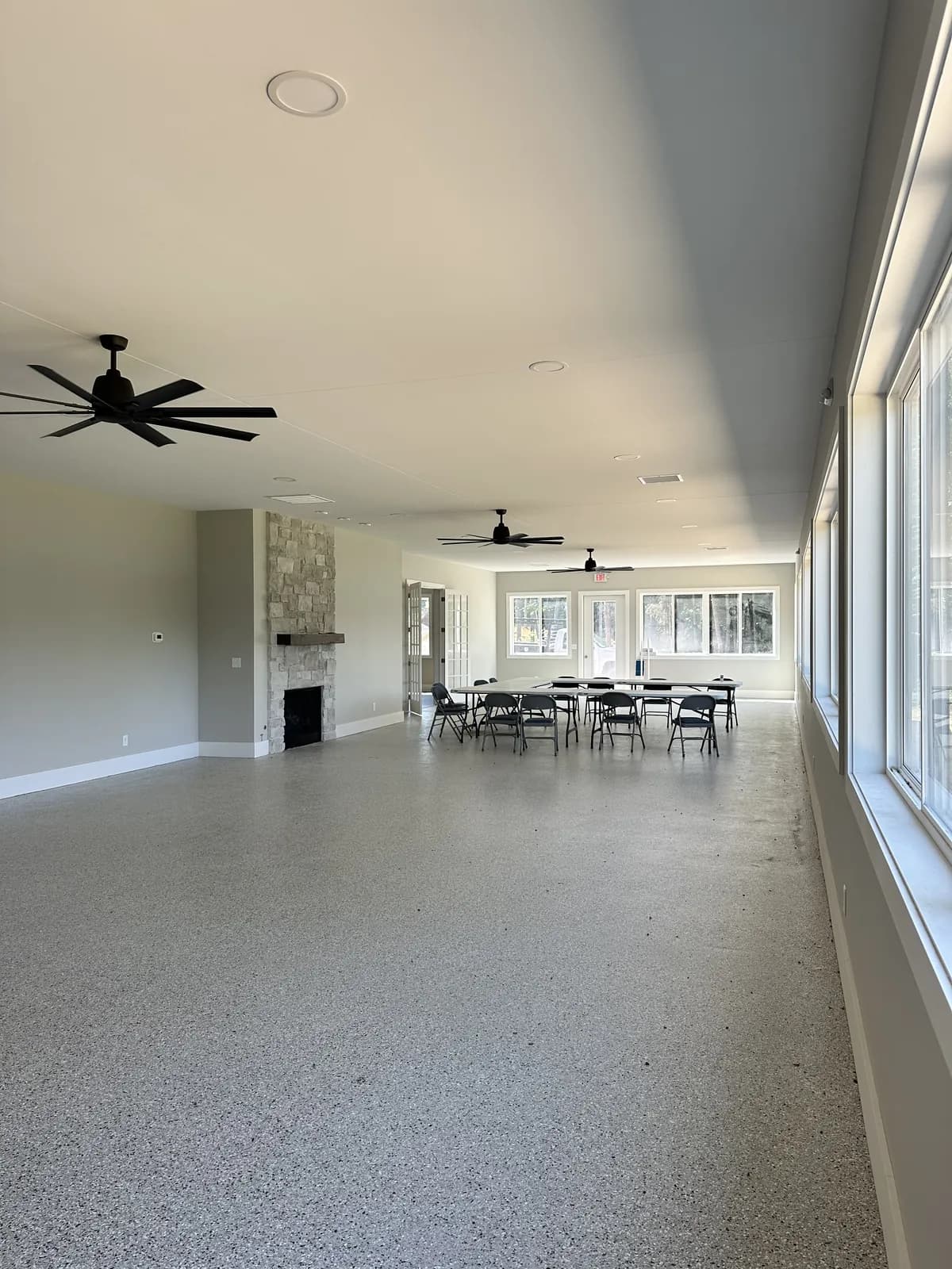 The activity center interior, fireplace and lake-view windows