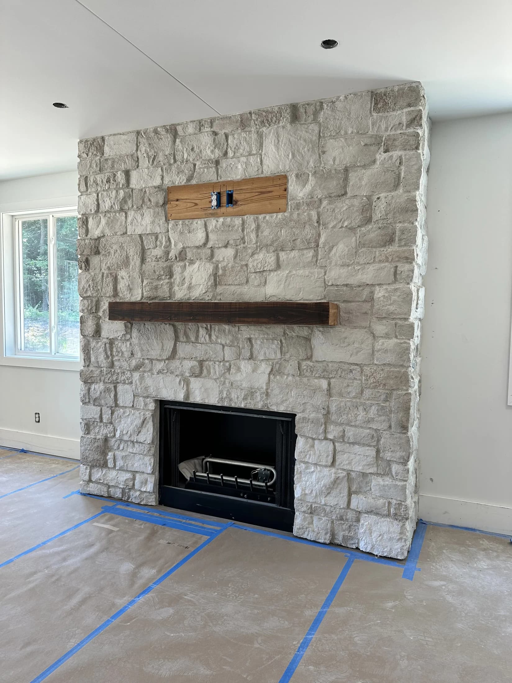 The stone fireplace inside the lodge