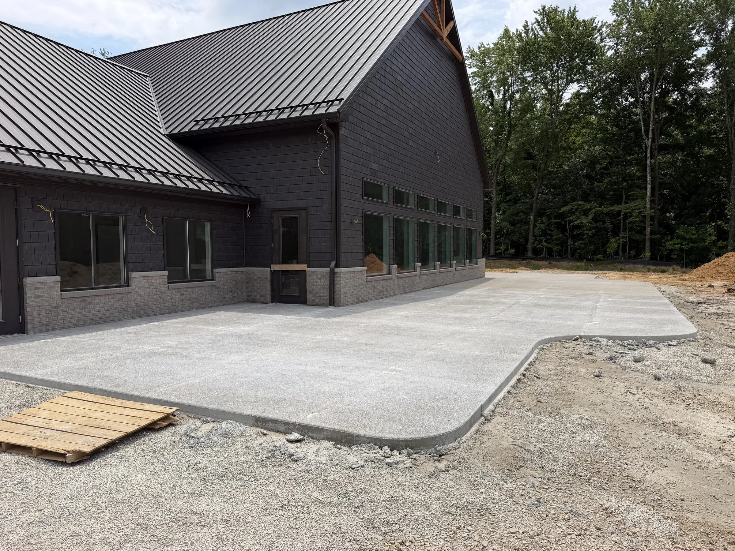 The lodge under construction, side elevation, summer 2026
