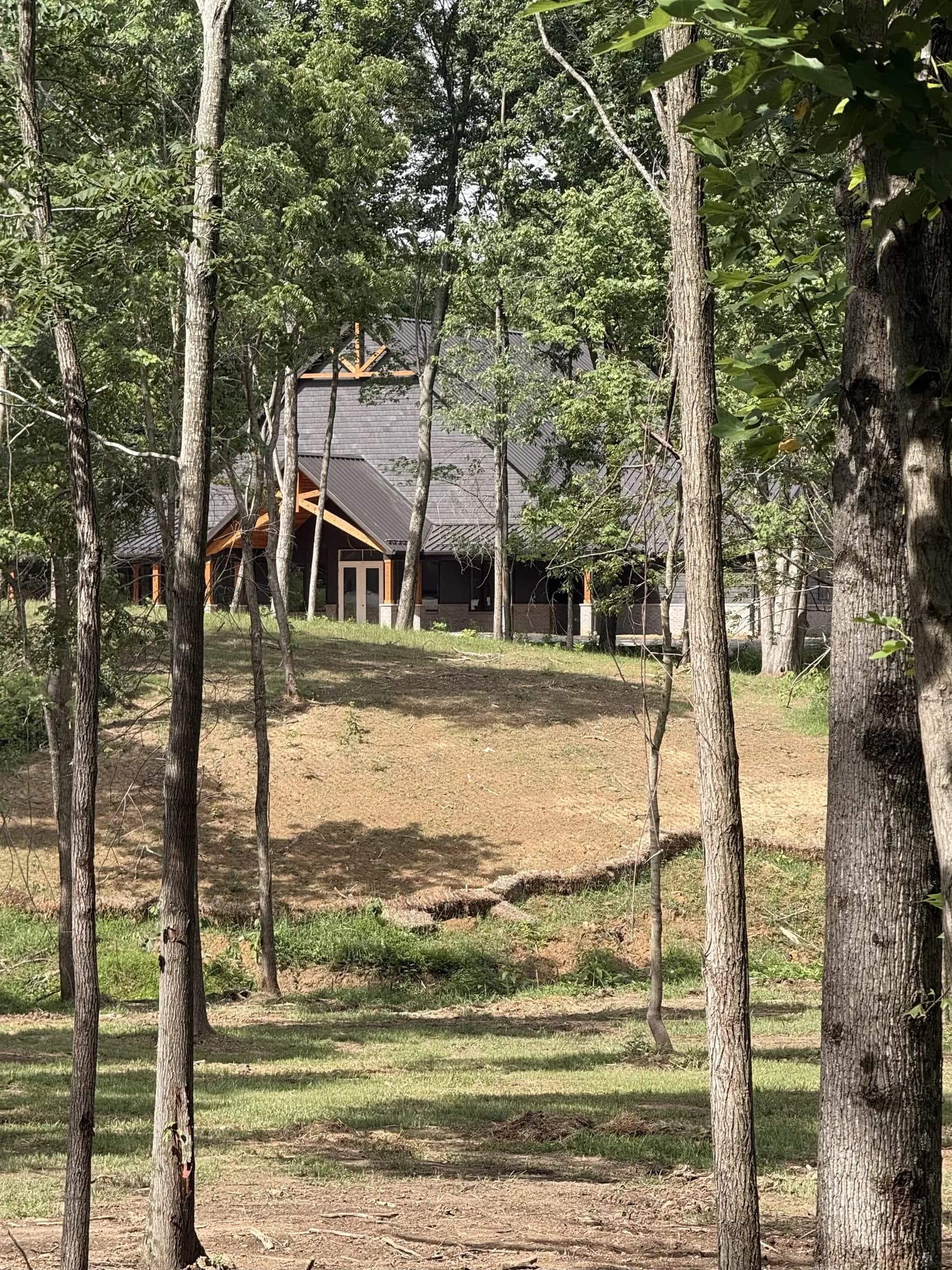 The lodge seen through the trees
